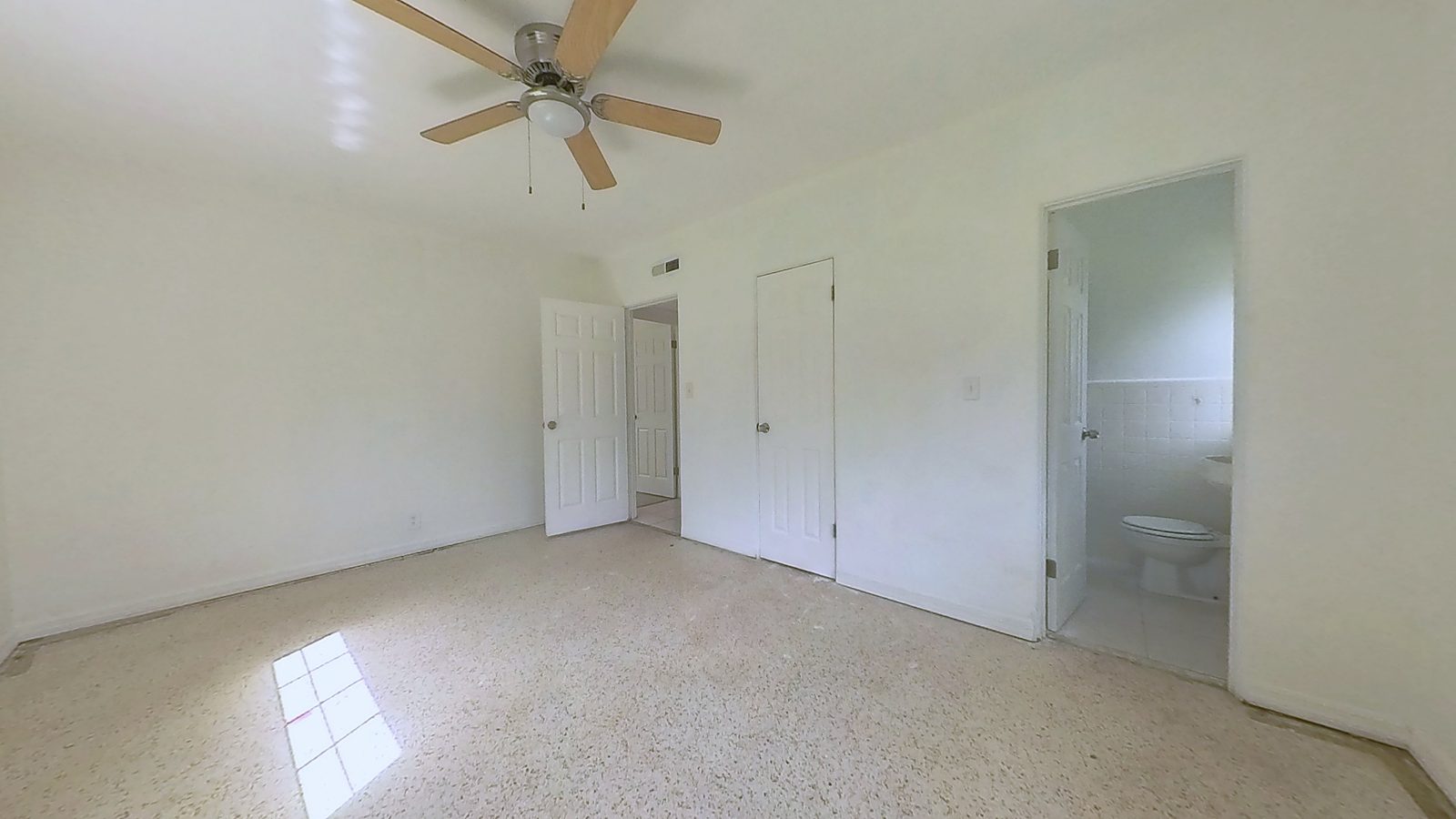 Primary bedroom with original 1959 terrazzo floors